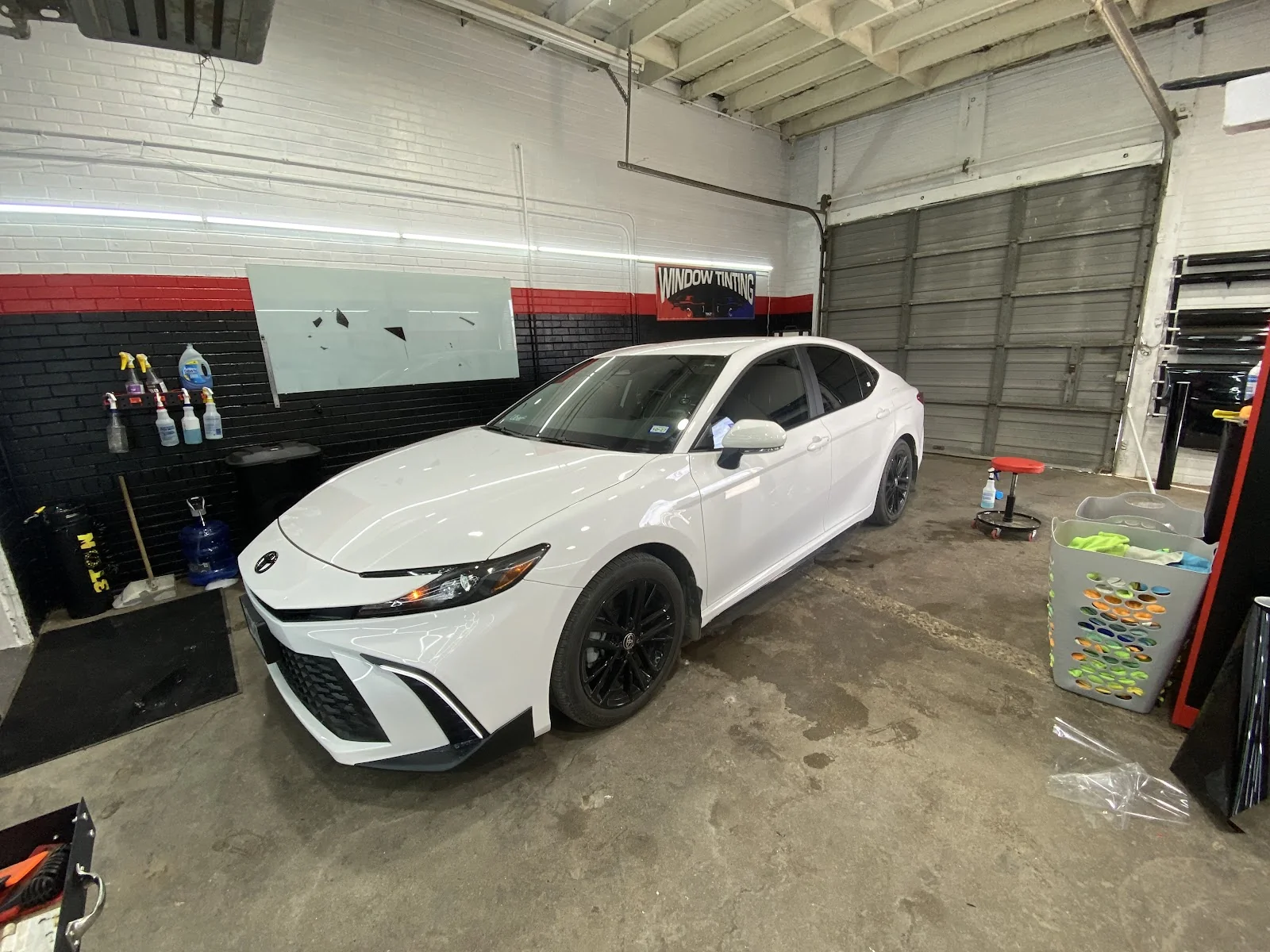 Inside Latin Tinting — shop interior and work bay